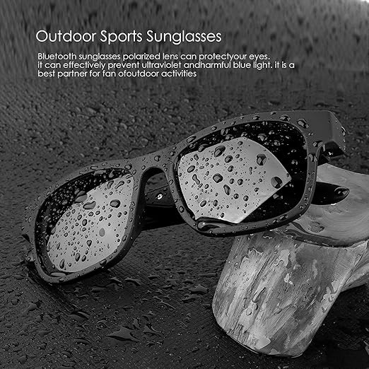 Bluetooth outdoor sports sunglasses, black, with polarized lenses, water splashes on frame, resting on a wet rock.